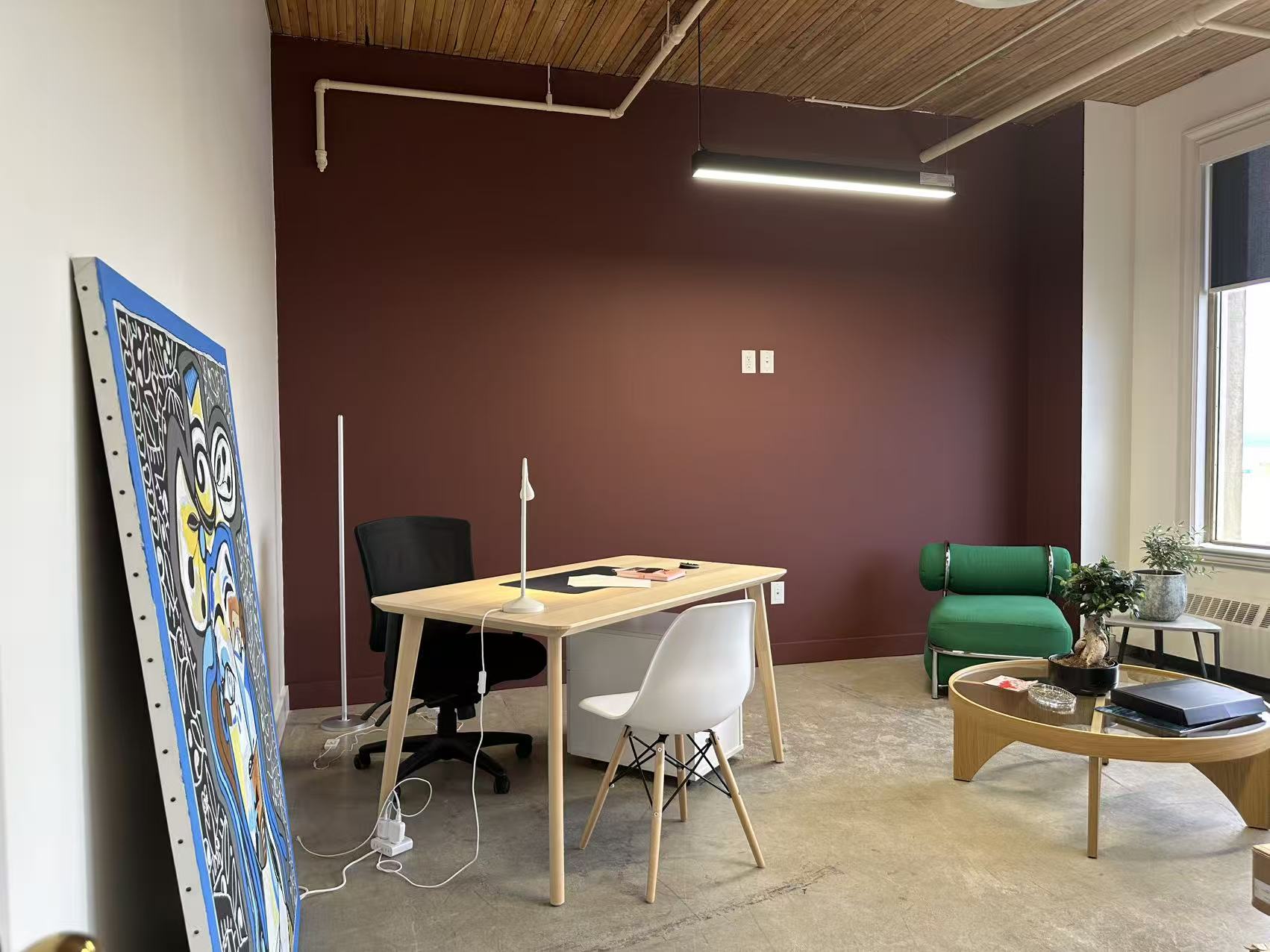 Breakout room with desk and lounge chair